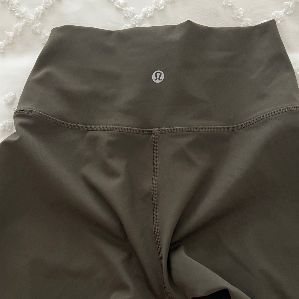 Lululemon leggings dark olive color. 23” inseam, size 4.